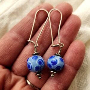 Murano glass beads and silver drop earrings.